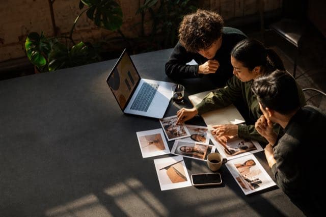 Marketing team reviewing product imagery and digital campaign direction